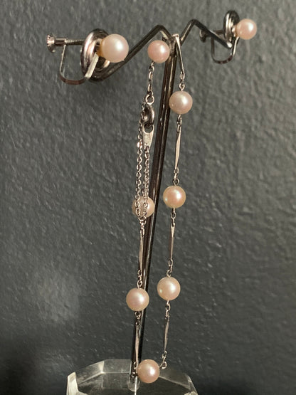 A Pearl and silver ear rings and bracelet