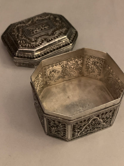 An octagonal silver box
