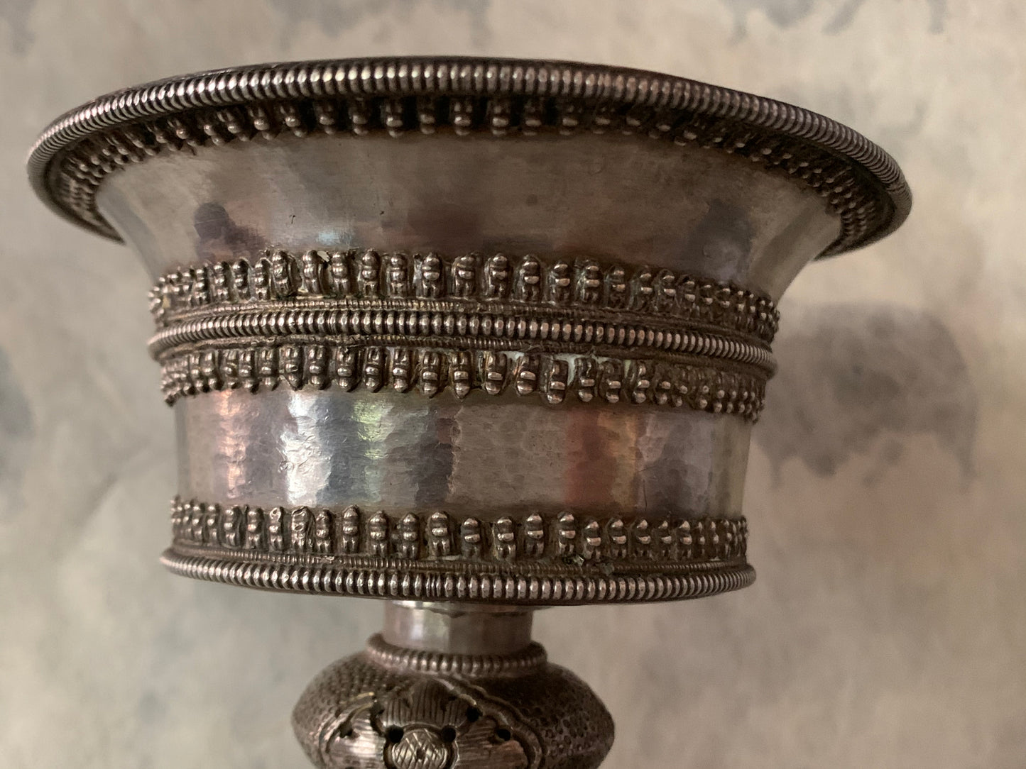 An antique Tibetan silver butterlamp