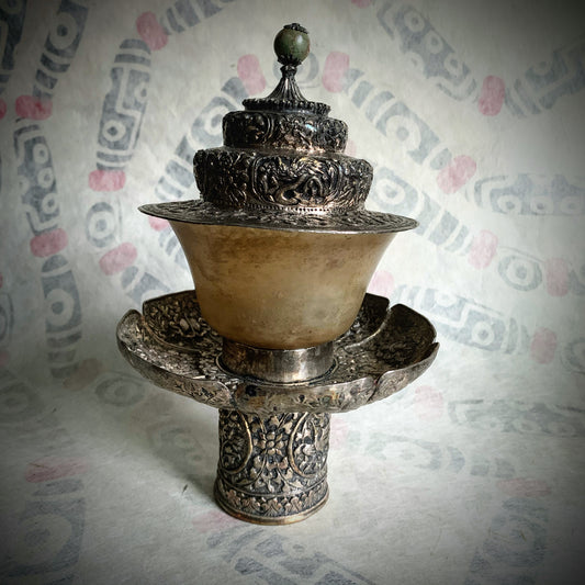 A silver Tibetan cup stand