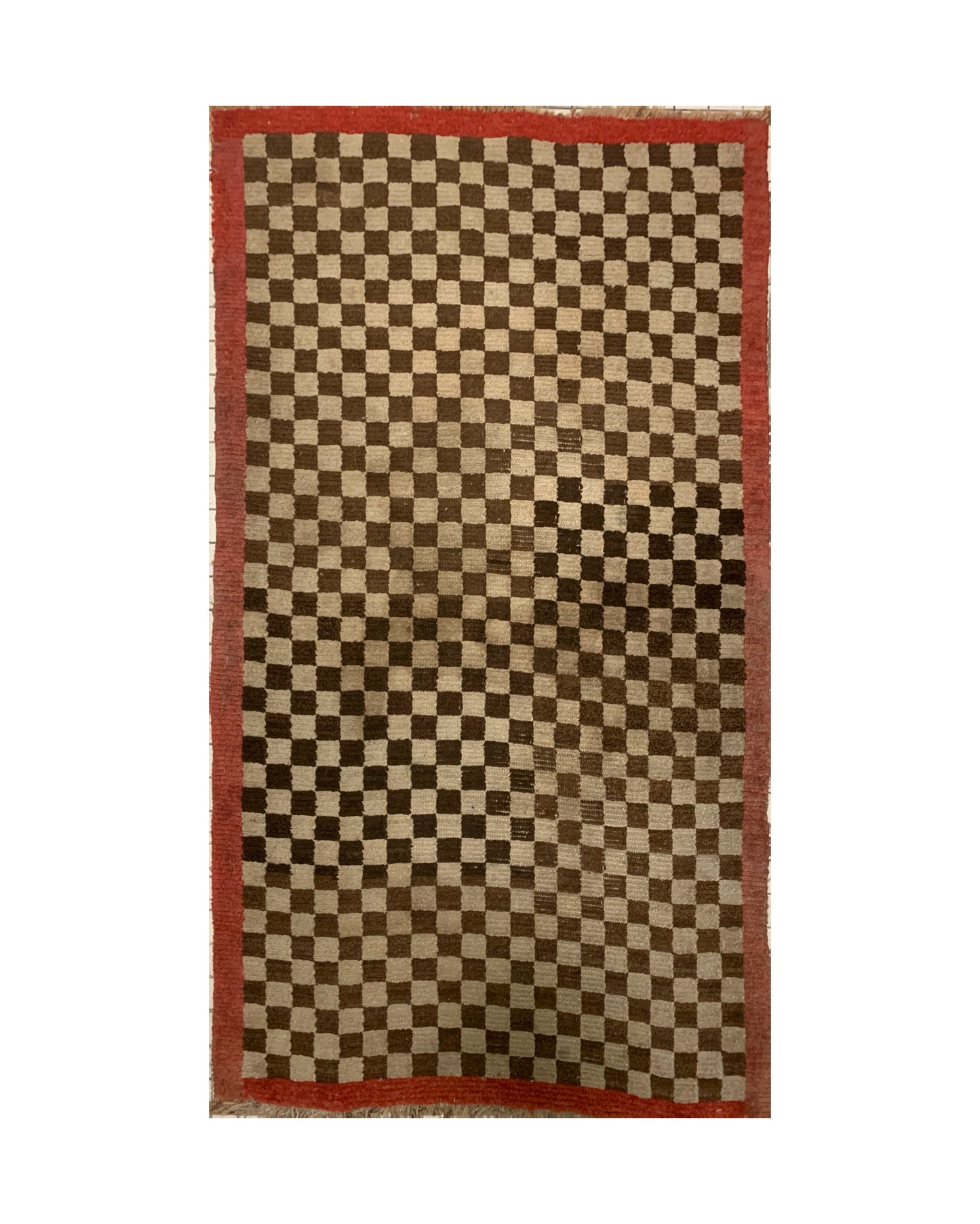 An antique Tibetan checkerboard rug