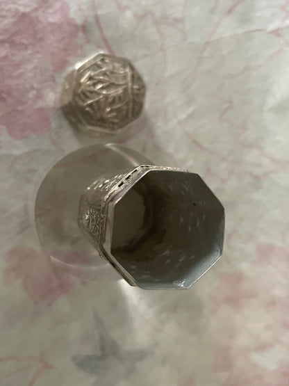 An antique octagonal shaped silver box with lid from south east Asia.