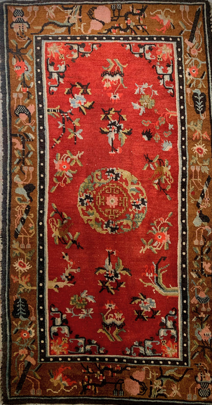 An antique Tibetan wool rug