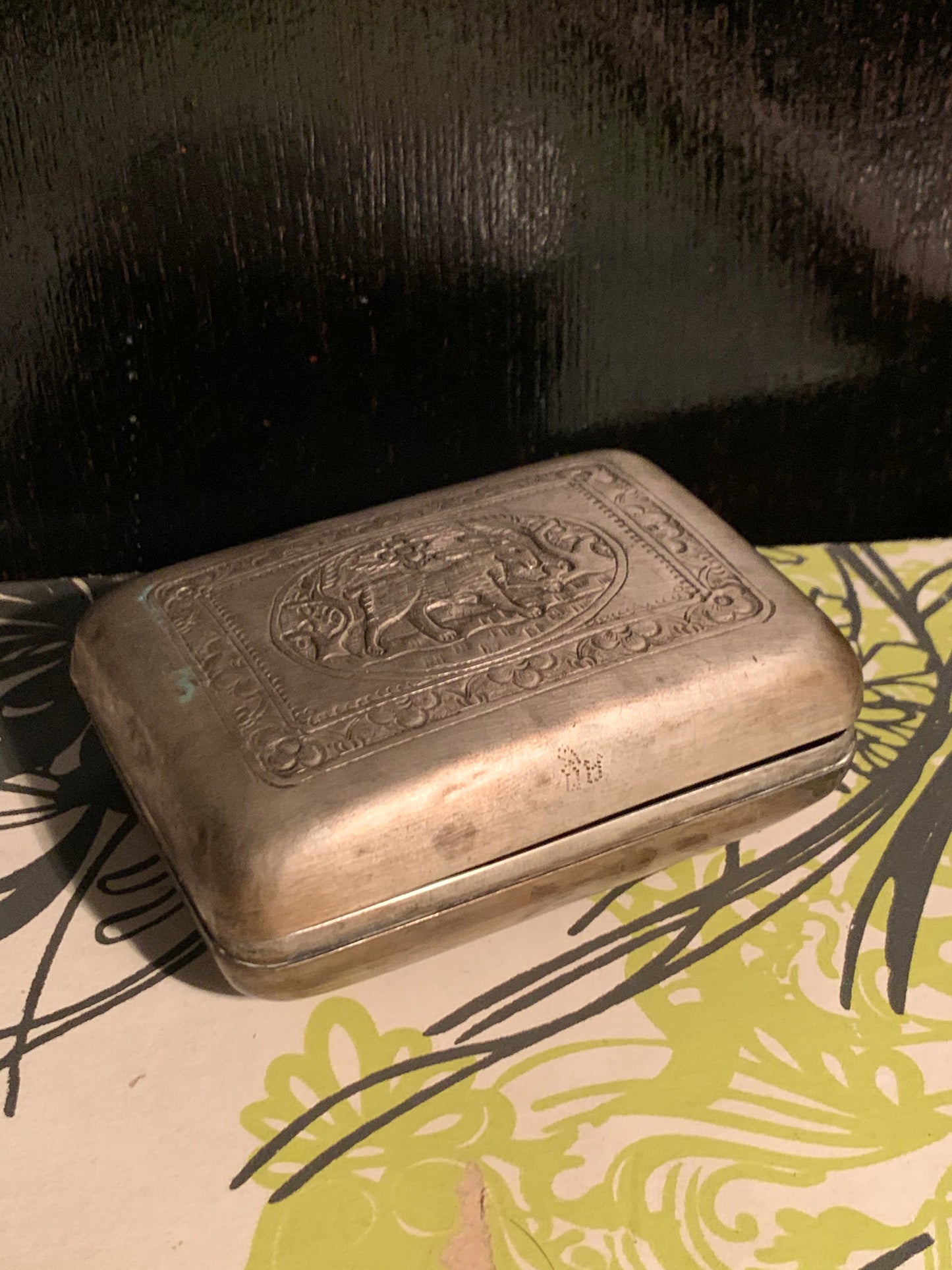 A silver box with hinged lid