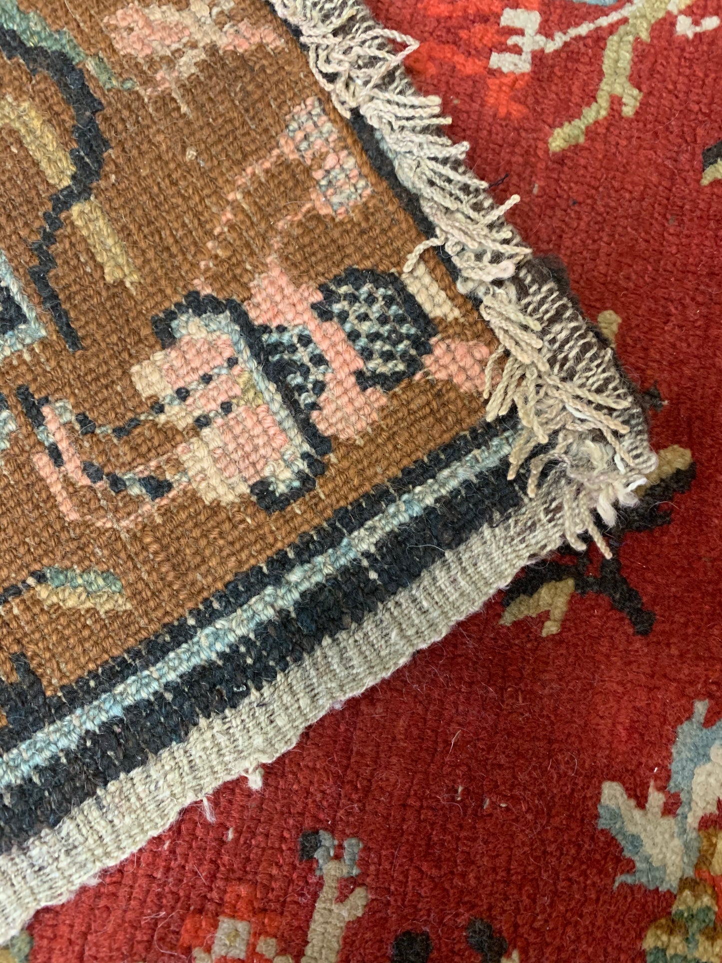 An antique Tibetan wool rug