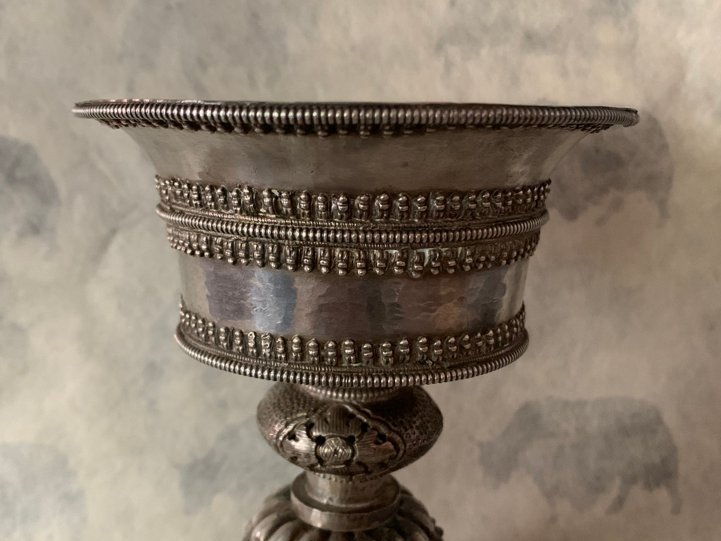 An antique Tibetan silver butterlamp