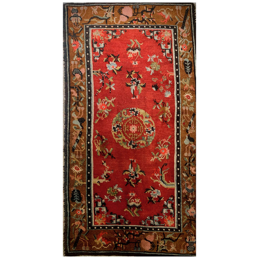 An antique Tibetan wool rug