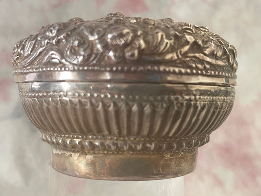 An antique silver south East Asian round box with lid