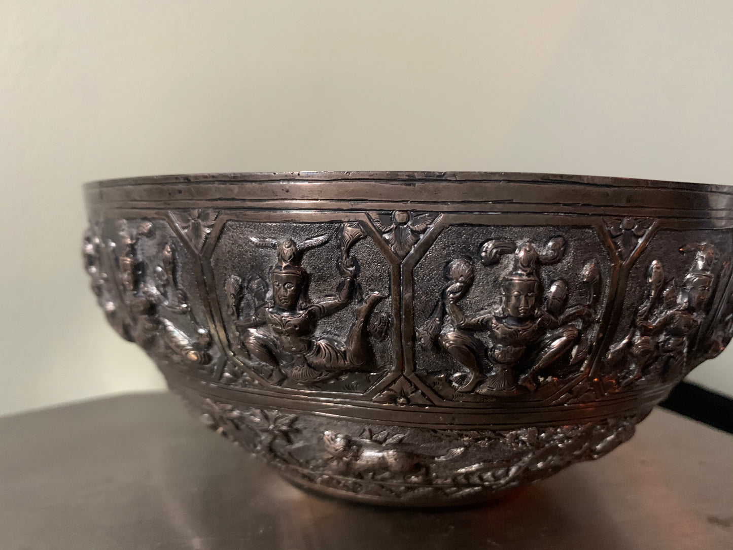 A silver repousse bowl