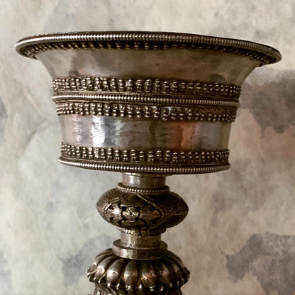 An antique Tibetan silver butterlamp
