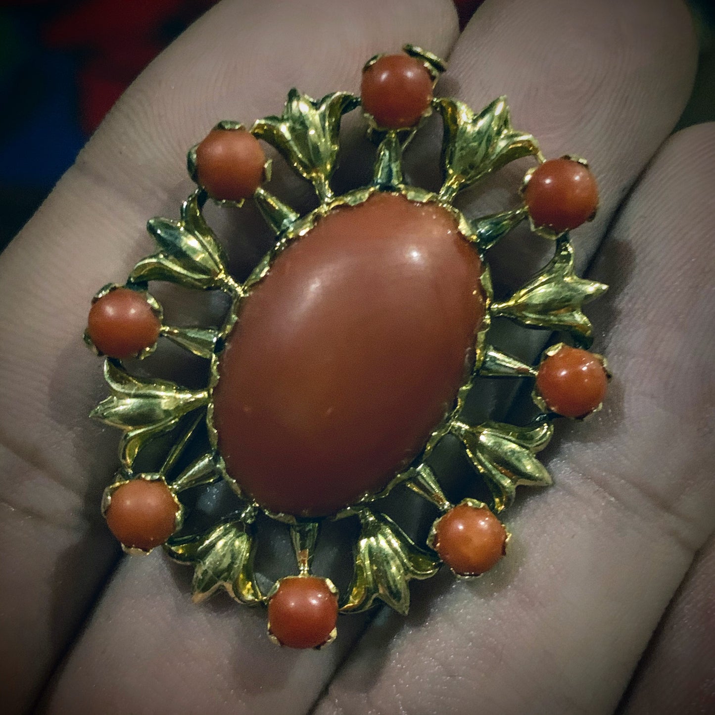 A vintage red coral brooch in 18kt setting
