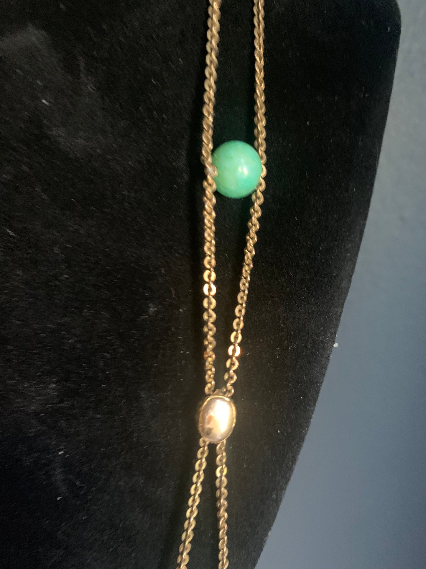A jade and gold necklace