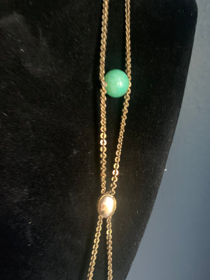 A jade and gold necklace