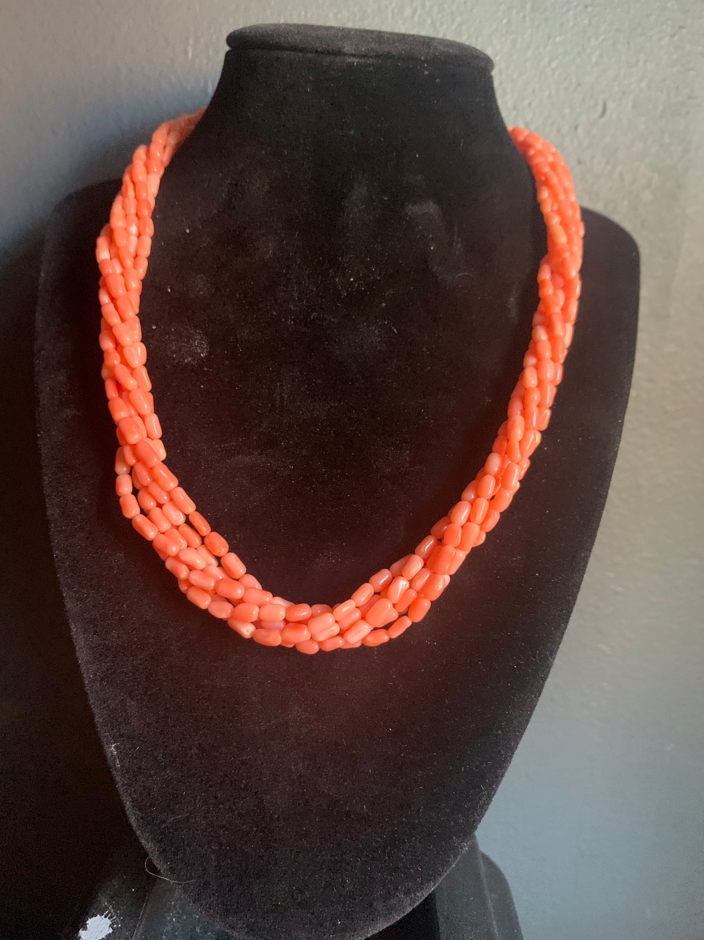 A multi-strand coral bead necklace