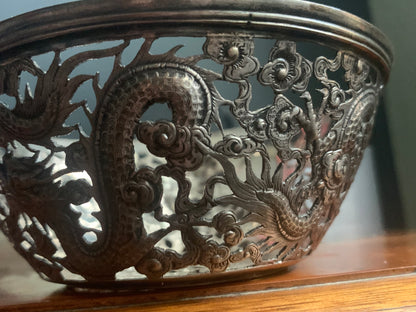 A silver bowl sleeve