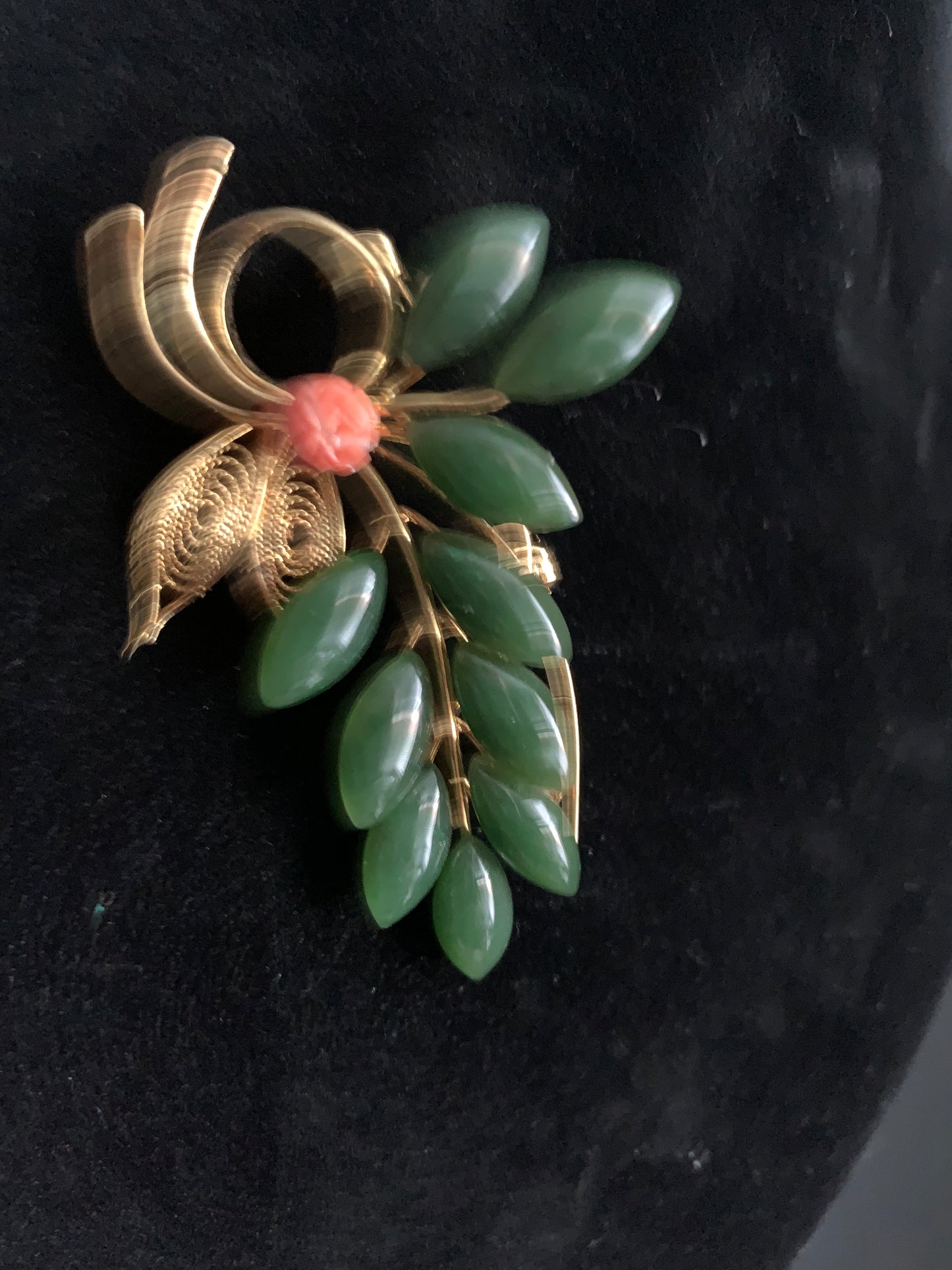 A jade and coral brooch