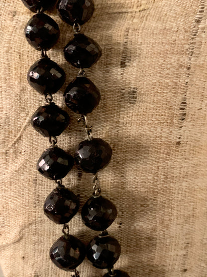 An antique faceted garnet necklace