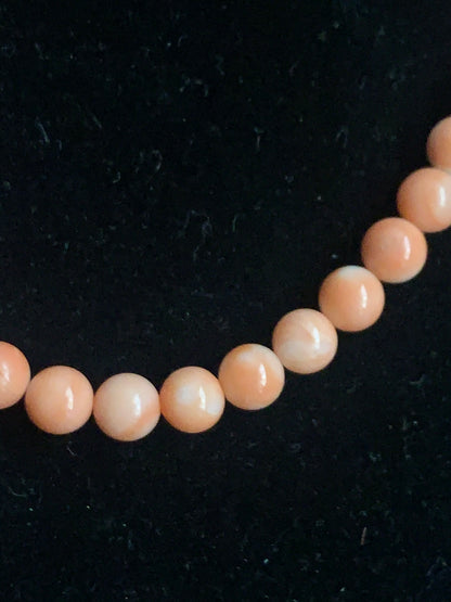 A salmon color coral necklace