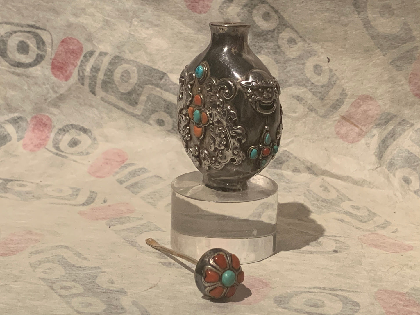 A Mongolian silver snuff bottle - with coral and turquoise