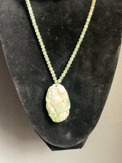 A jade necklace and pendant