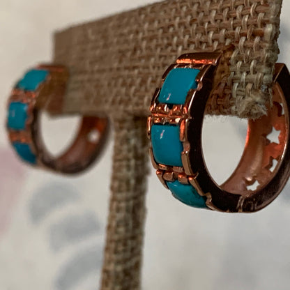 A pair of turquoise hoop earrings