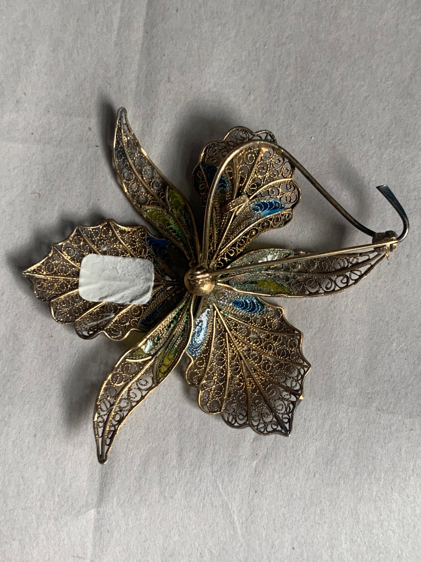 A filigree/ enamel Florence-orchid brooch