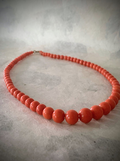 A 16” long antique coral necklace