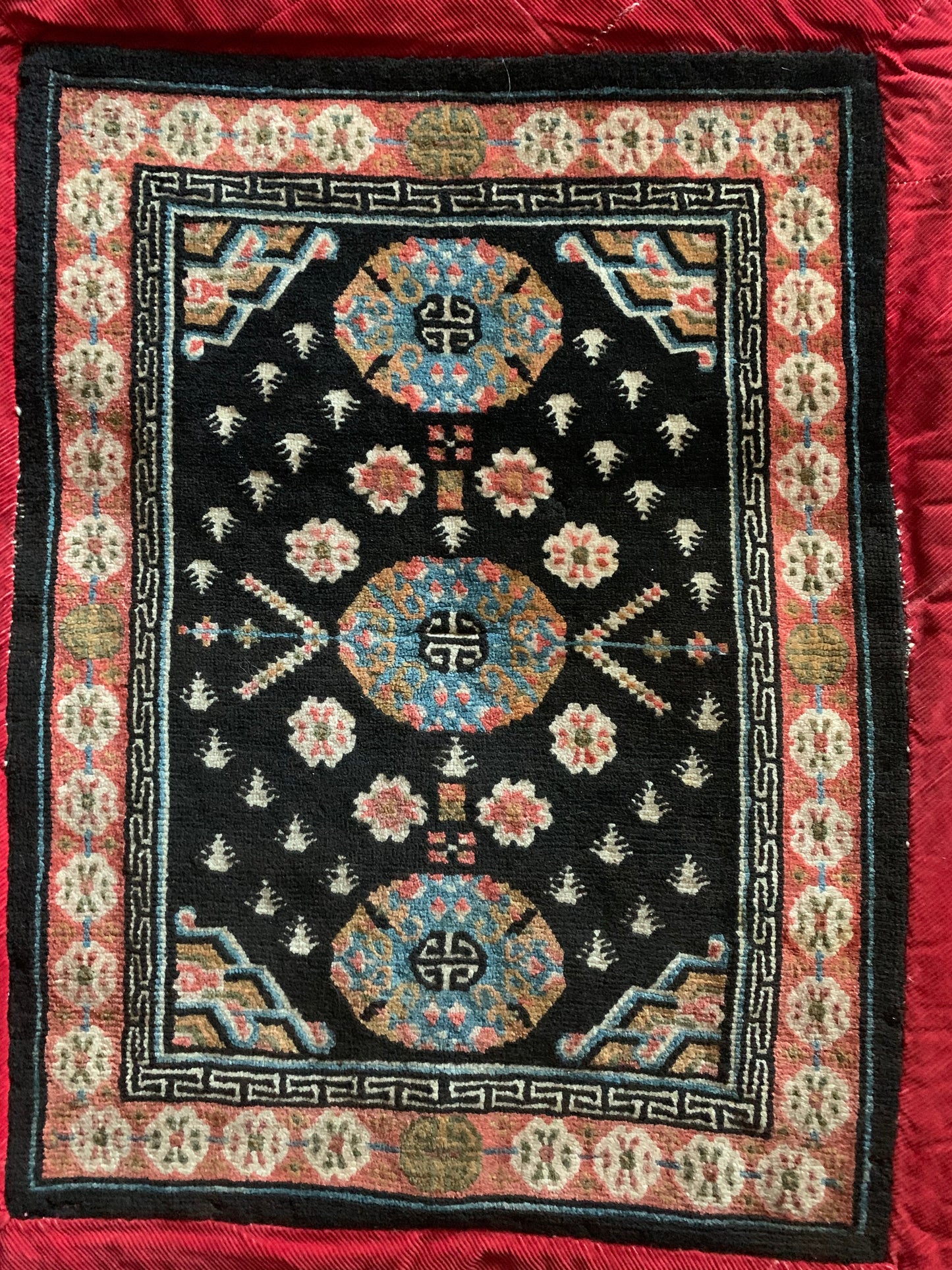 An antique Tibetan horse blanket carpet and saddle topper