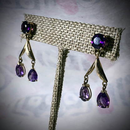 A pair of amethyst gold earrings