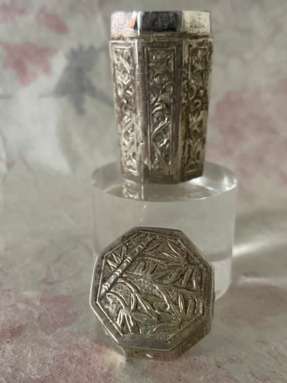An antique octagonal shaped silver box with lid from south east Asia.