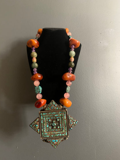 A vintage Tibetan ghau necklace