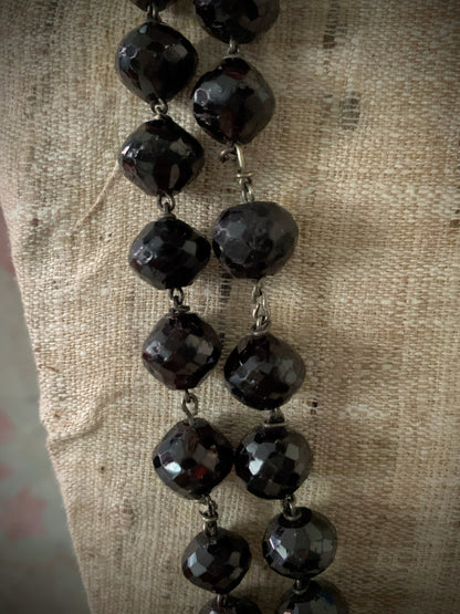 An antique faceted garnet necklace