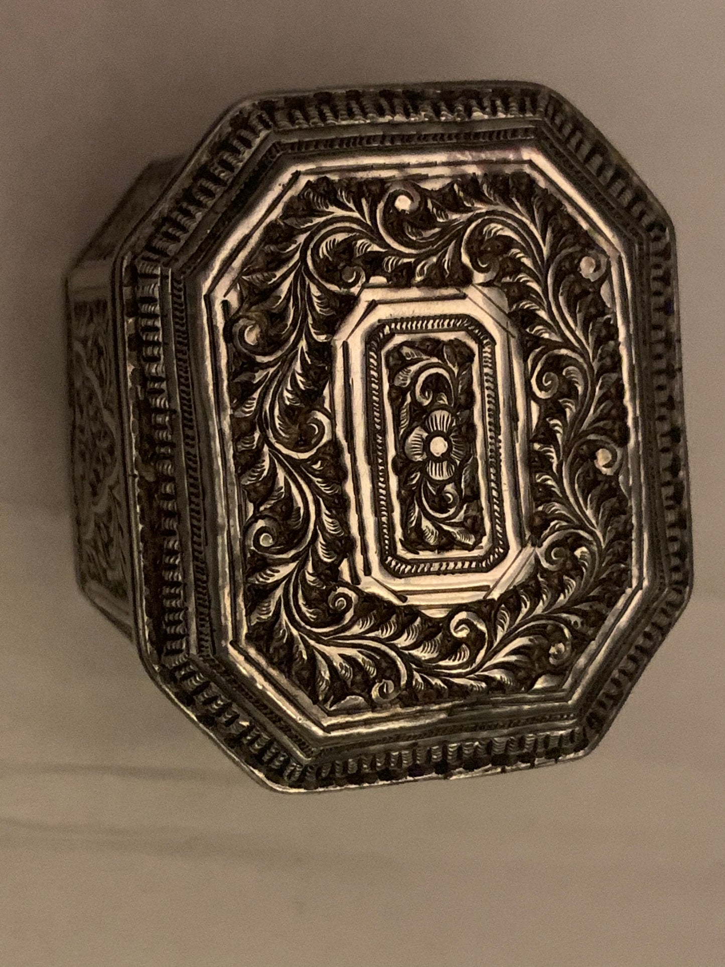 An octagonal silver box