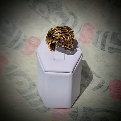 An 18k gold and diamond ring