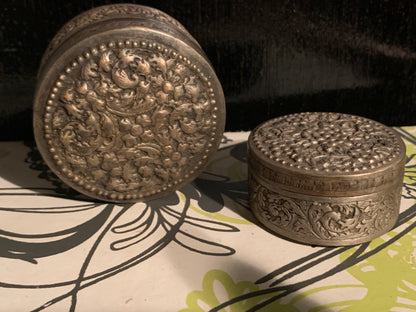 Two metal pill boxes