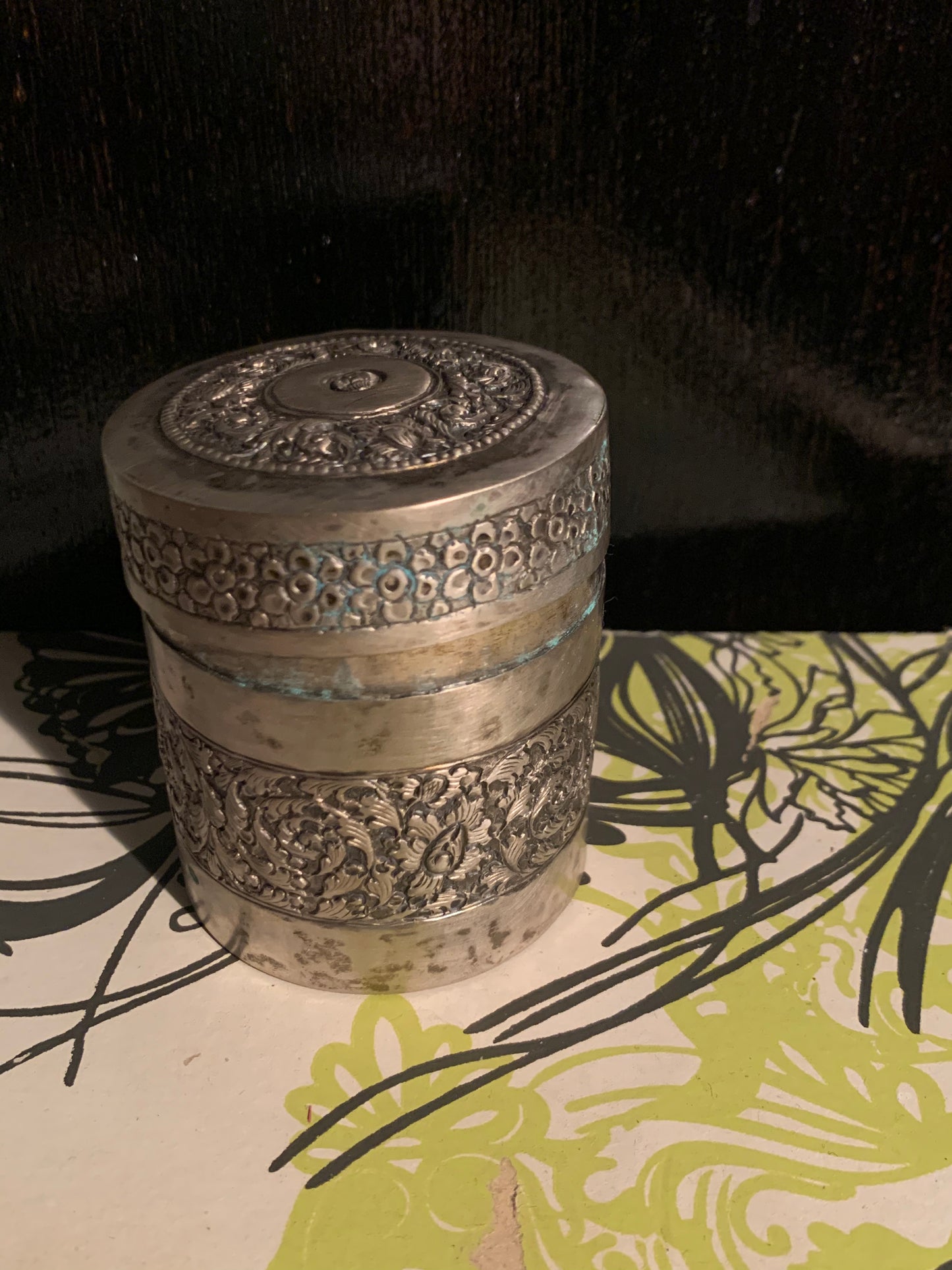 A cylindrical metal box