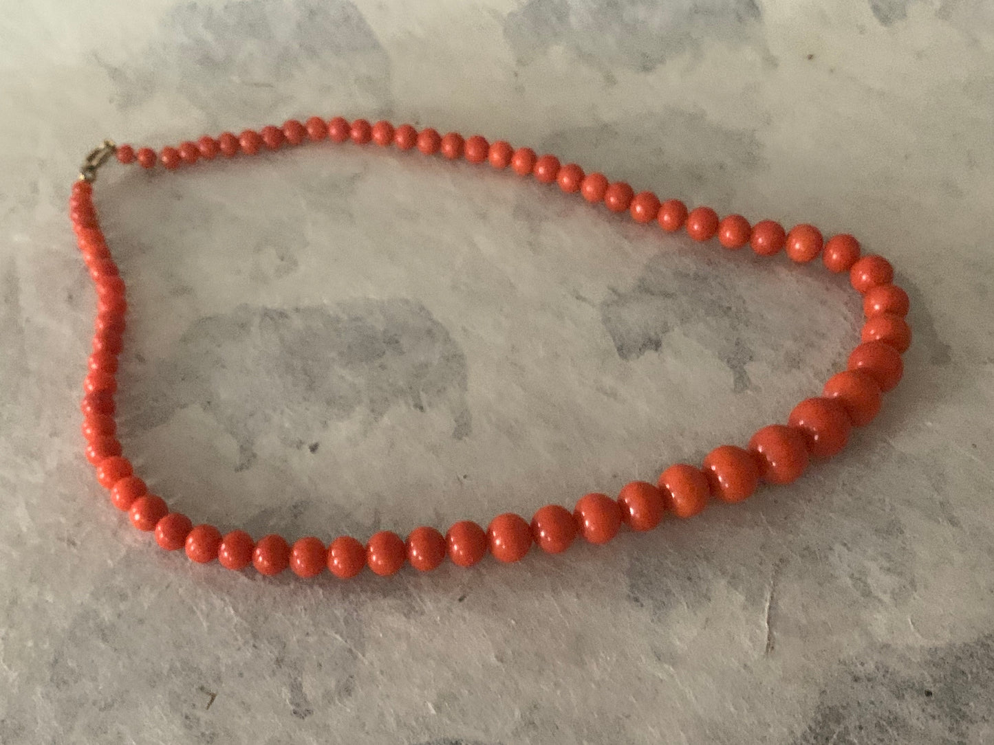 A 16” long antique coral necklace
