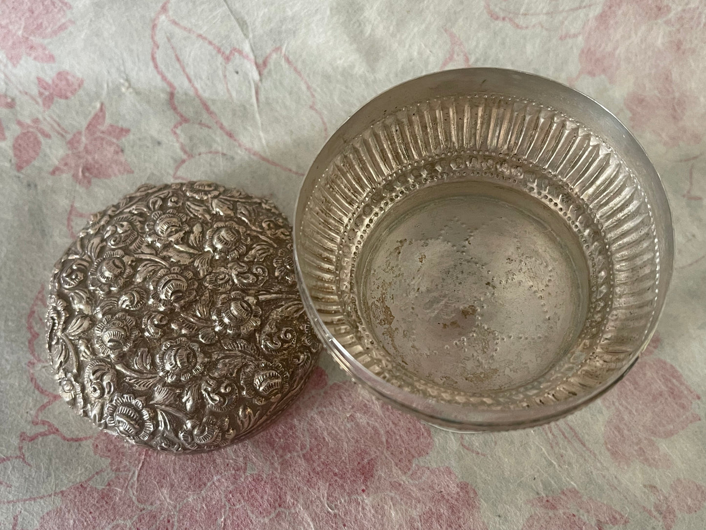 An antique silver south East Asian round box with lid