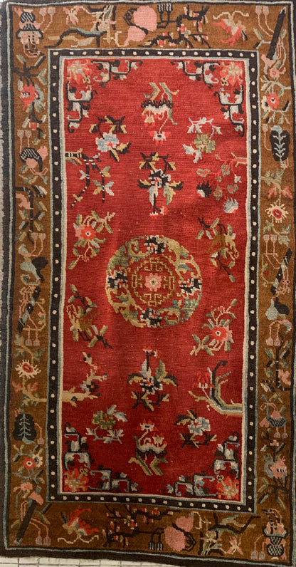 An antique Tibetan wool rug
