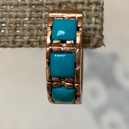 A pair of turquoise hoop earrings