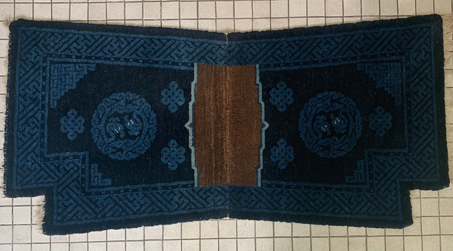 A vintage indigo saddle rug