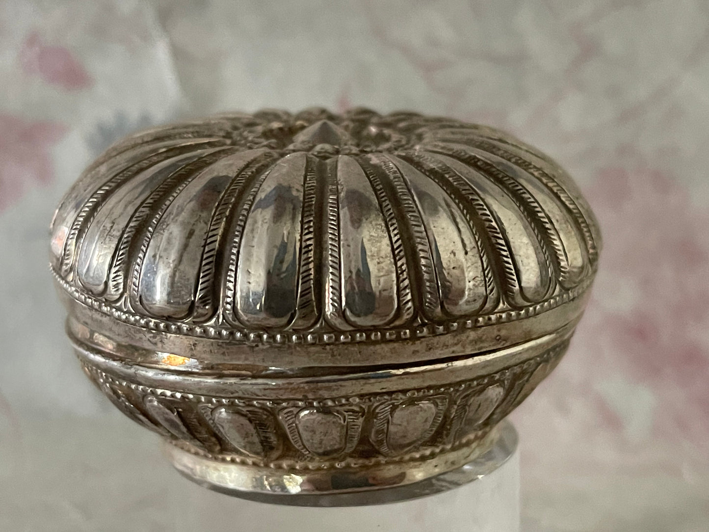 An antique silver south East Asian round box with lid