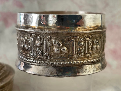 An antique silver south East Asian round box with lid