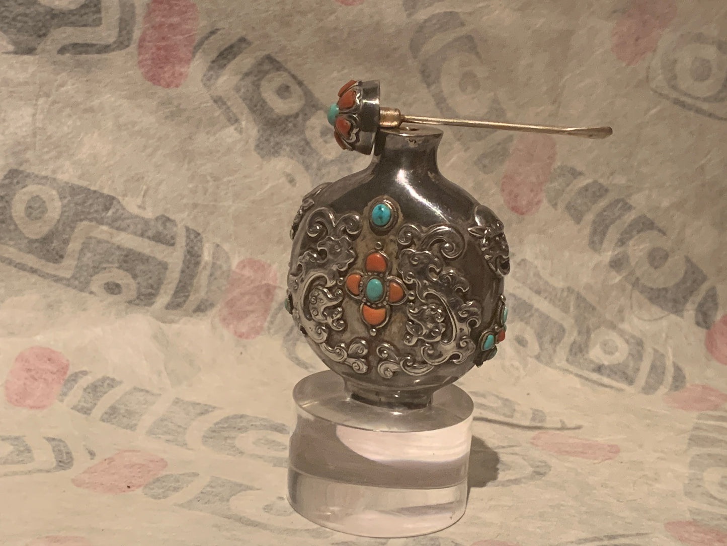 A Mongolian silver snuff bottle - with coral and turquoise