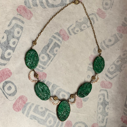 A spinach green jade necklace