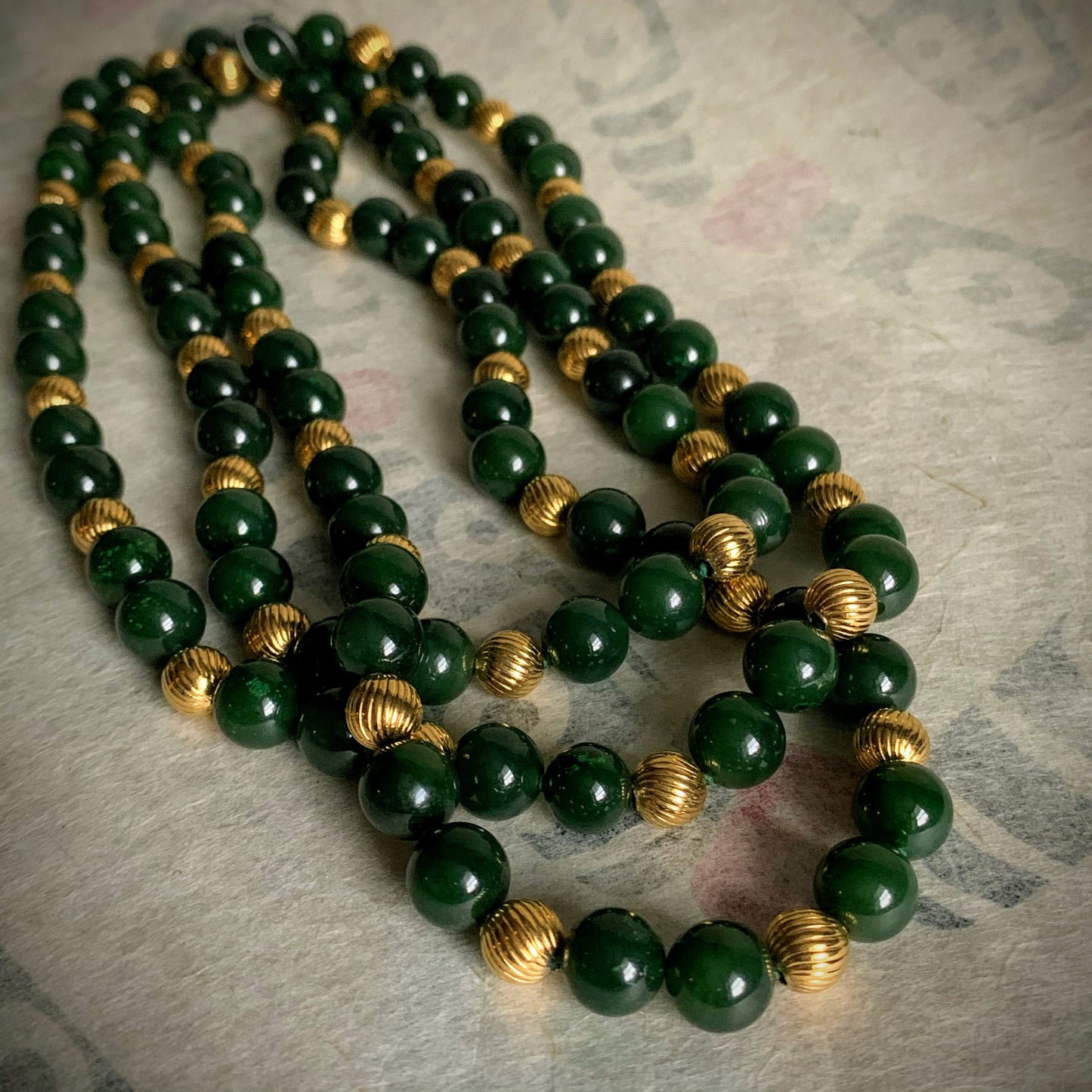 A nephrite jade and 14kt gold bead necklace
