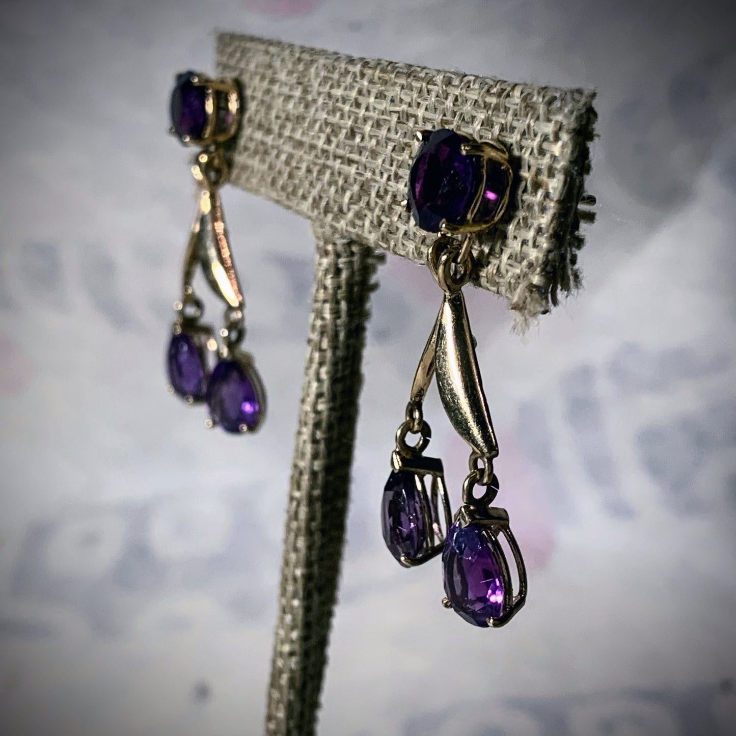 A pair of amethyst gold earrings