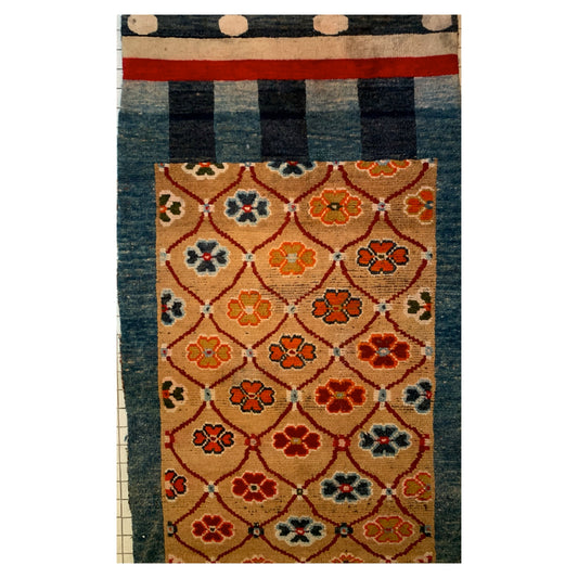 An antique Tibetan door curtain rug