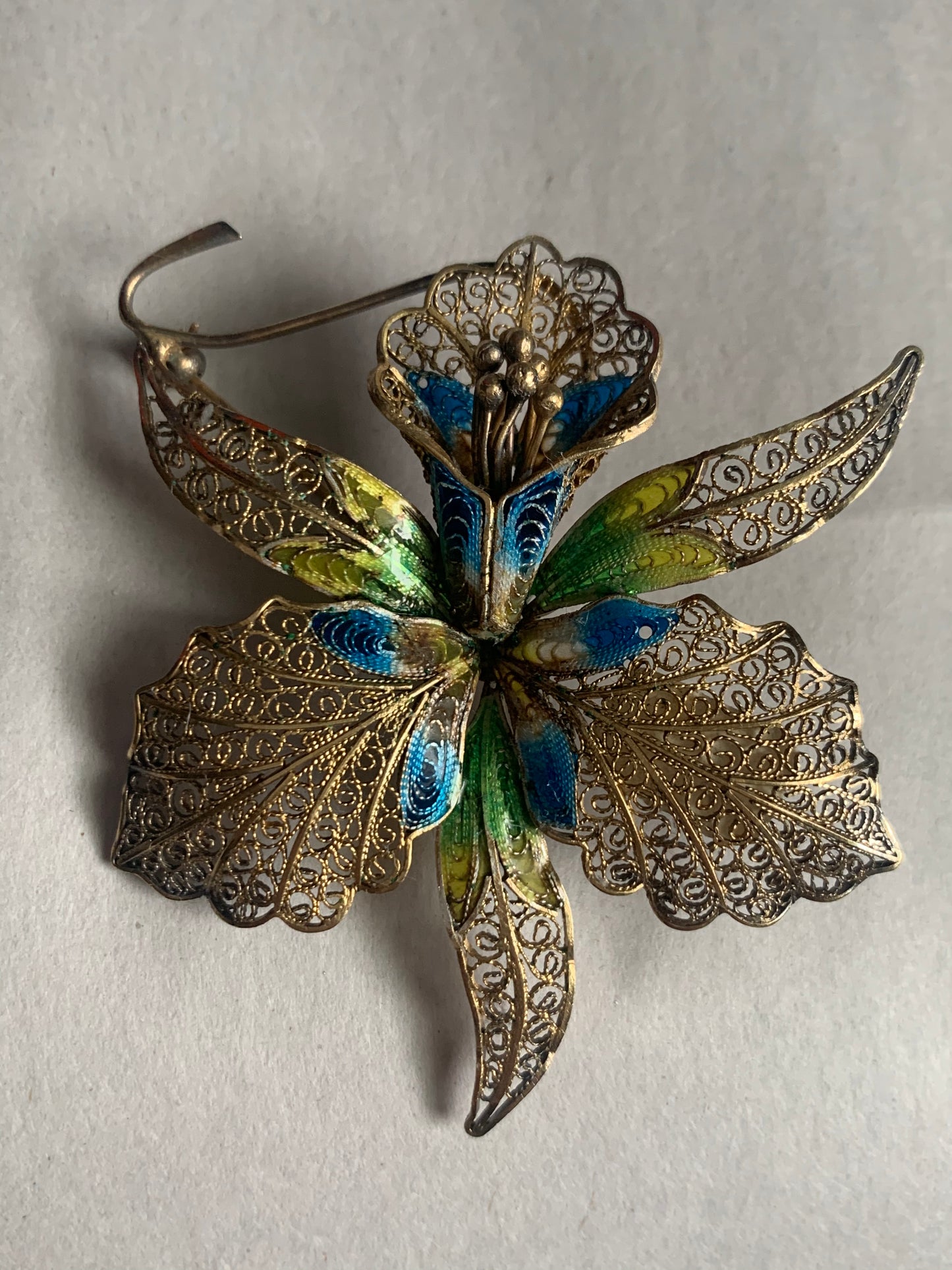 A filigree/ enamel Florence-orchid brooch