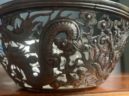 A silver bowl sleeve